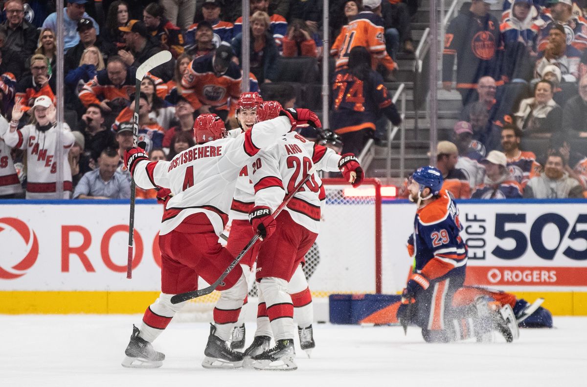 Carolina Hurricanes players celebrate a goal as Edmonton Oilers' Leon Draisaitl (29) reacts during overtime NHL action in Edmonton on Tuesday, October 22, 2024.