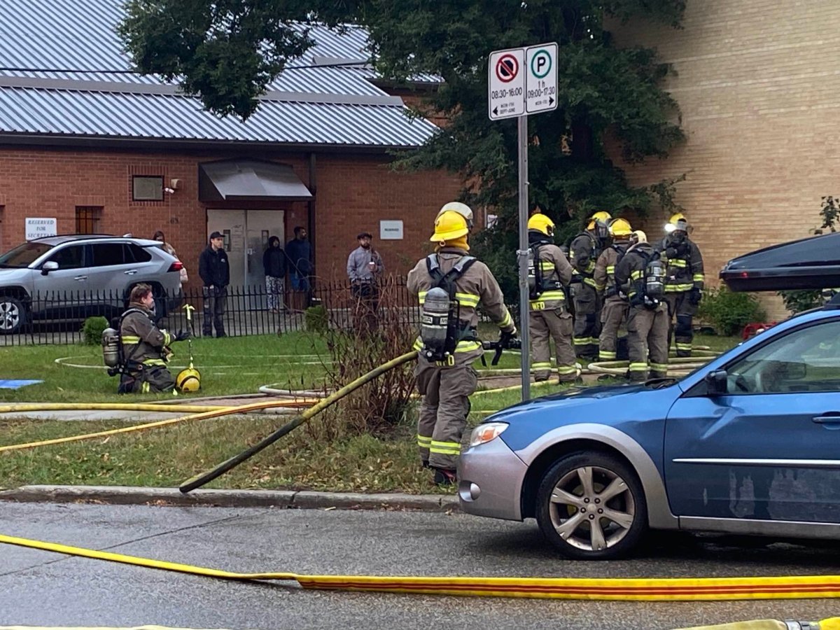 Winnipeg firefighters at the scene of a Wolseley Avenue apartment fire.