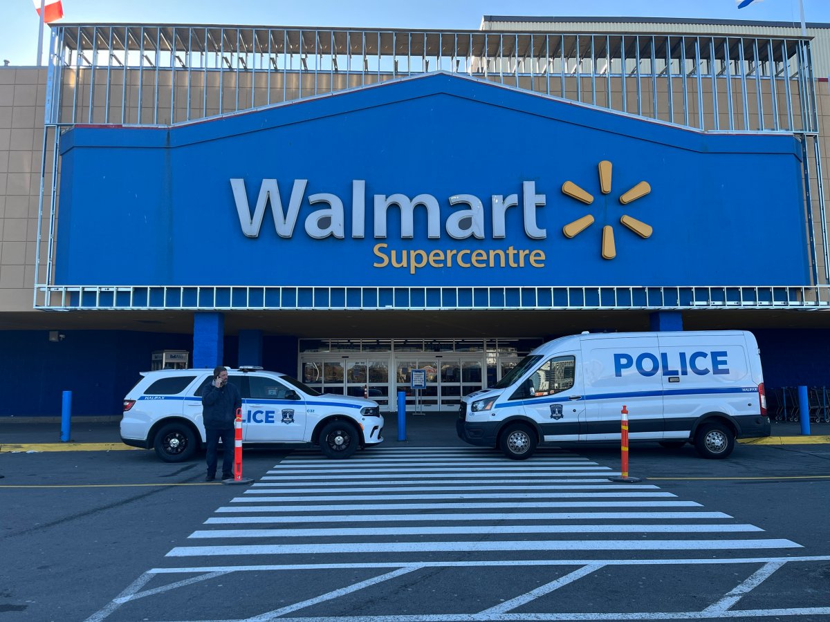 HRM police officers stand outside of the Walmart located on Mumford Rd, Halifax.