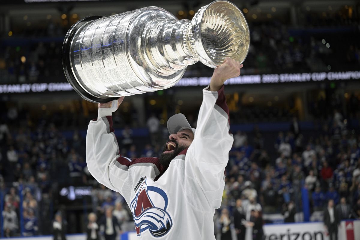 FILE - Colorado Avalanche centre Nazem Kadri (91) lifts the Stanley Cup after the team defeated the Tampa Bay Lightning in Game 6 of the NHL hockey Stanley Cup Finals on June 26, 2022, in Tampa, Fla.