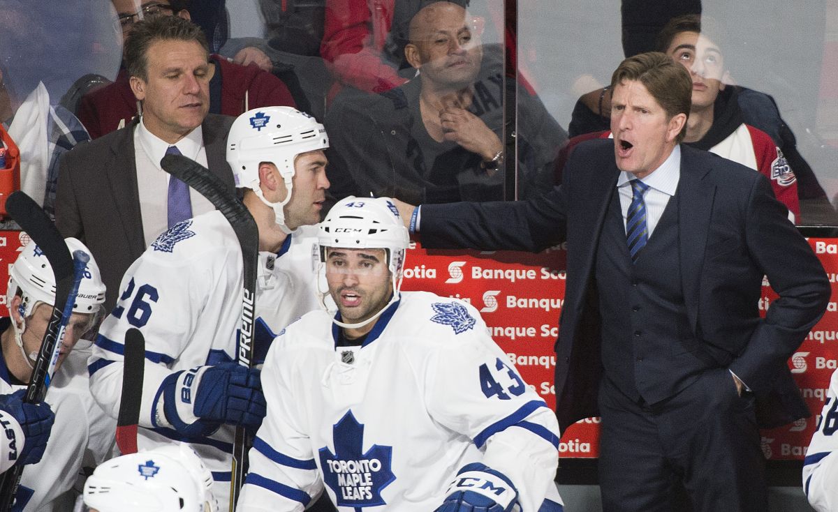 Toronto Maple Leafs head coach Mike Babcock reacts from the bench as player Nazem Kadri (43) looks on during an NHL hockey game against the Montreal Canadiens in Montreal, Saturday, October 24, 2015.