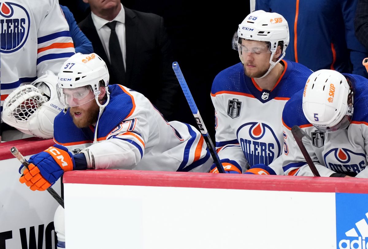 Edmonton Oilers forward Connor McDavid (97), defenceman Philip Broberg (86) and defenceman Cody Ceci (5) react after losing to the Florida Panthers in game 7 of the NHL Stanley Cup finals in Sunrise, Fla., on Monday, June 24, 2024.