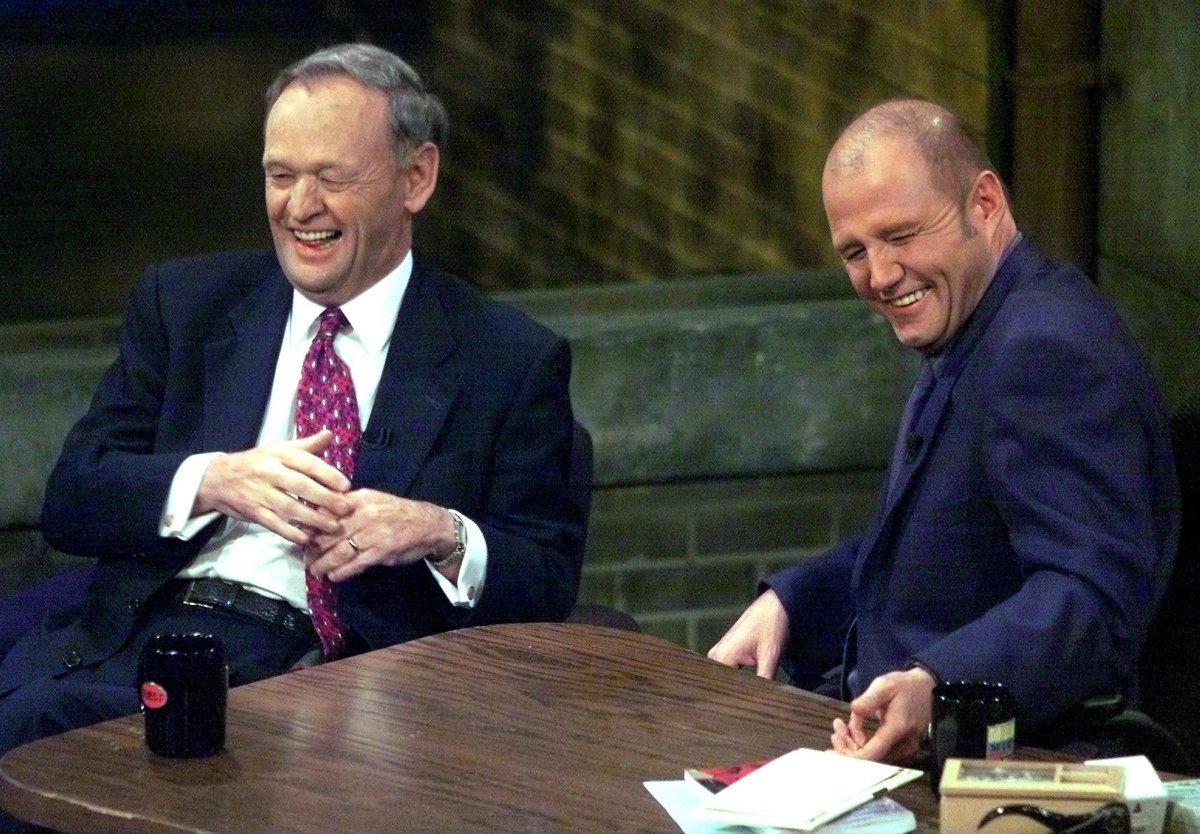 Prime Minister Jean Chretien (left) and Mike Bullard laugh during the taping of Open Mike with Mike Bullard in Toronto on Thursday May 17, 2001.