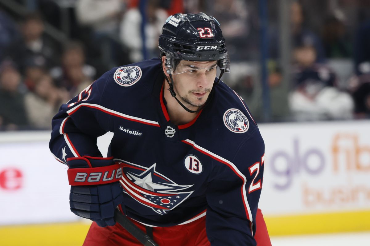 Columbus Blue Jackets players, including Sean Monahan wear helmet stickers and patches honouring Johnny Gaudreau and his brother Matthew during the first period of an NHL hockey game against the Florida Panthers Tuesday, Oct. 15, 2024, in Columbus, Ohio.