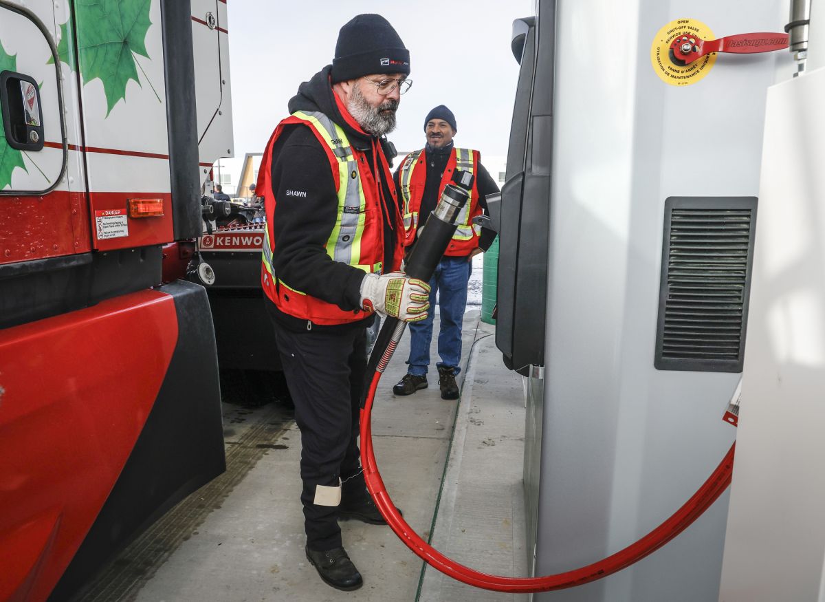 A commercial vehicle driver refuels at a compressed natural gas fueling station in Calgary, Alta., Tuesday, Oct. 22, 2024.