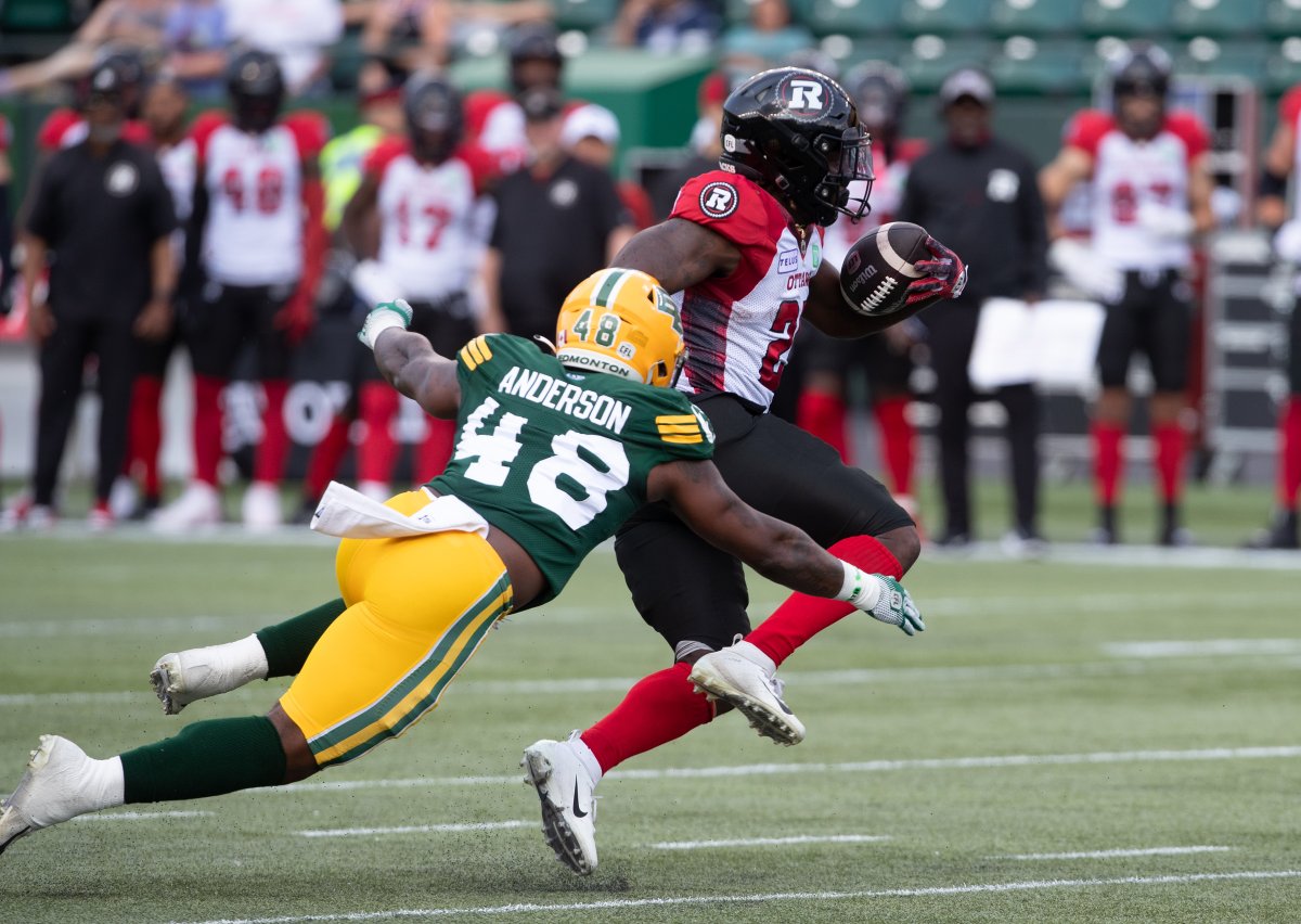 Ottawa Redblacks' Ryquell Armstead (25) is tackled by Edmonton Elks' Nick Anderson (48) during first half CFL action in Edmonton, Alta., on Sunday July 14, 2024.