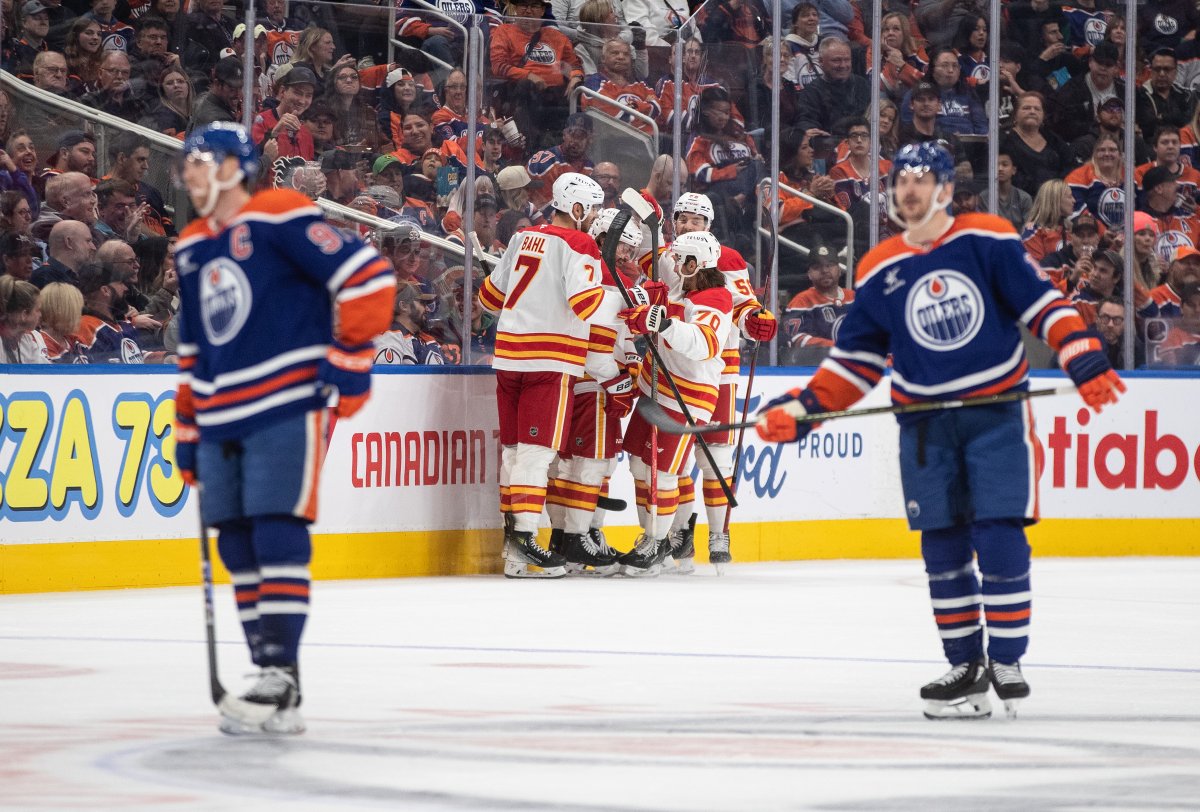 Calgary Flames celebrate a goal against the Edmonton Oilers during second period NHL action in Edmonton, Sunday, Oct. 13, 2024.