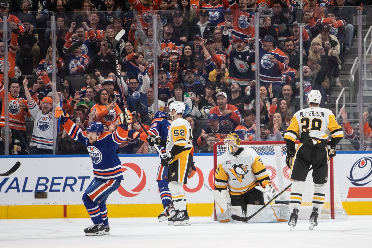 Pittsburgh Penguins goalie Joel Blomqvist (30) Marcus Pettersson (28) and Kris Letang (58) react as Edmonton Oilers' Viktor Arvidsson (left) celebrates a goal during third period NHL action in Edmonton on Friday, October 25, 2024.