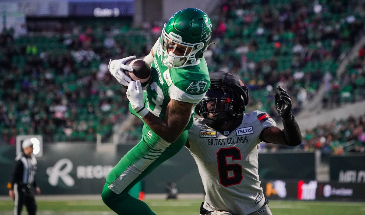 Saskatchewan Roughriders receiver Jerreth Sterns (83) makes a catch for a touchdown as B.C. Lions defensive back T.J. Lee (6) defends during the first half of CFL football action in Regina, on Saturday, October 12, 2024.