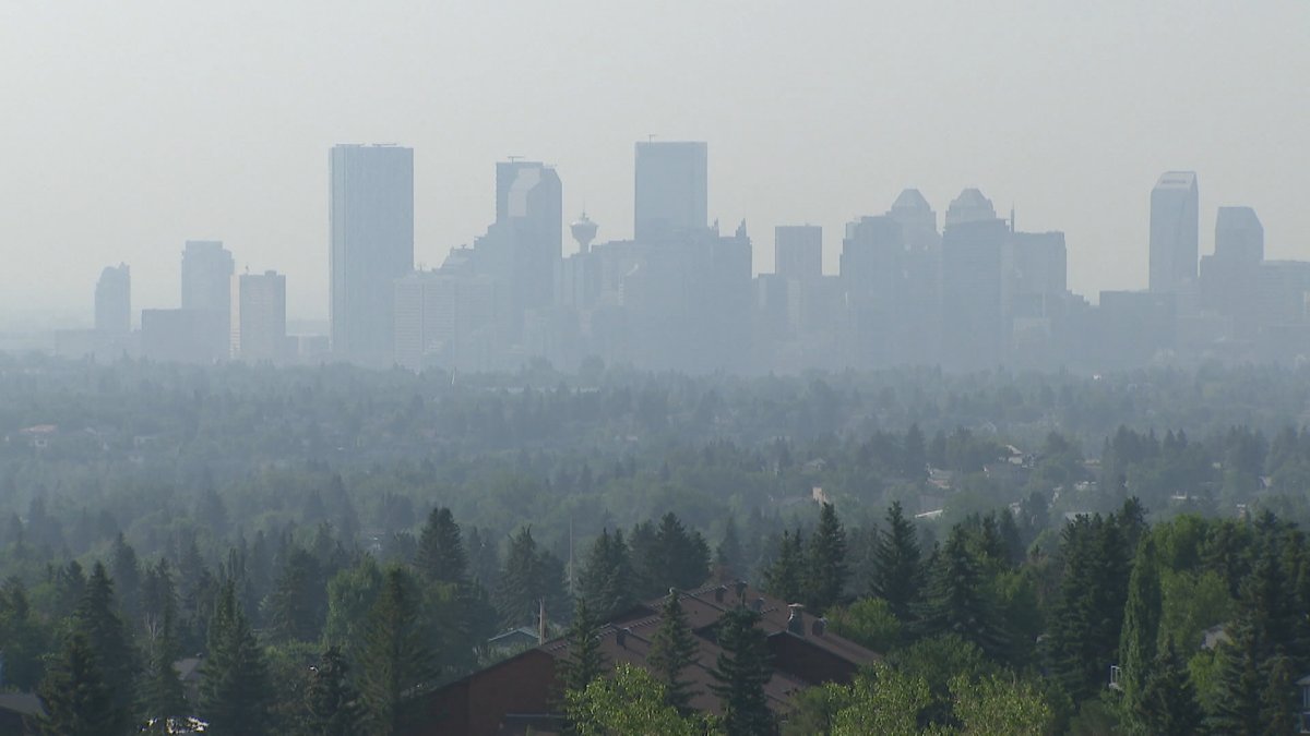 The City of Calgary skyline is partially obscured by wildfire smoke in July 2024.