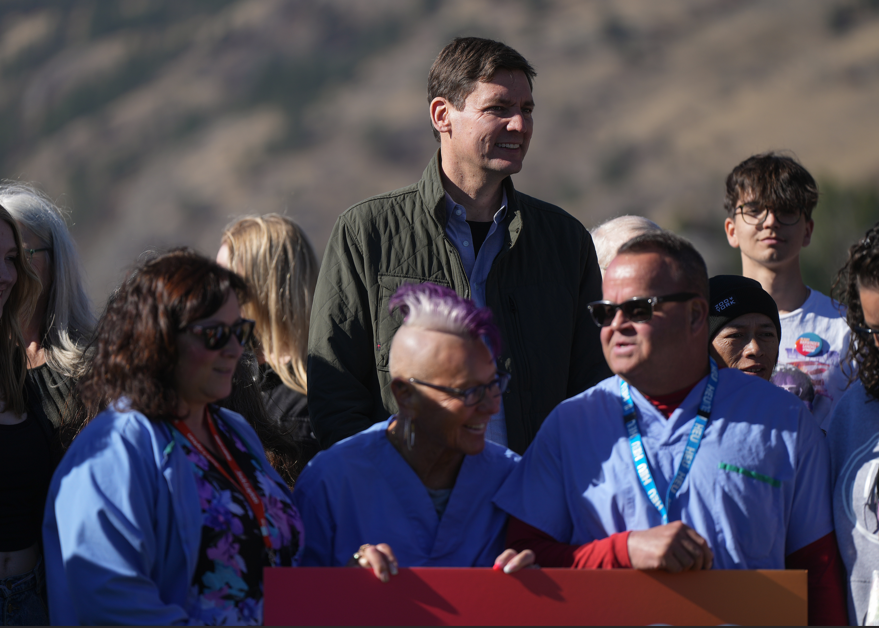 B.C. NDP Leader David Eby stands with healthcare workers and supporters after a campaign announcement, in Vernon, B.C., on Saturday, Oct. 5, 2024.