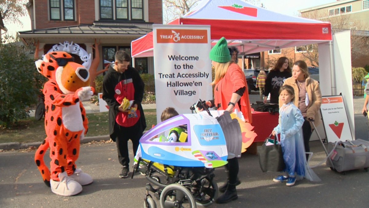 Costumed characters greet trick or treaters