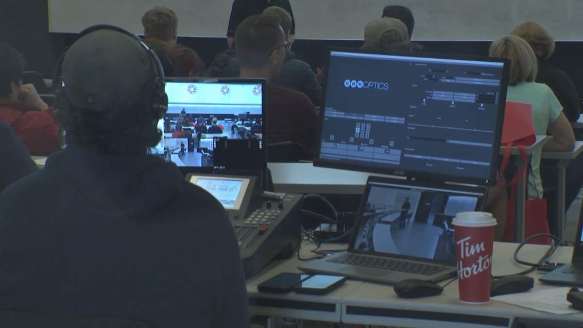 Student sits in front of a computer.