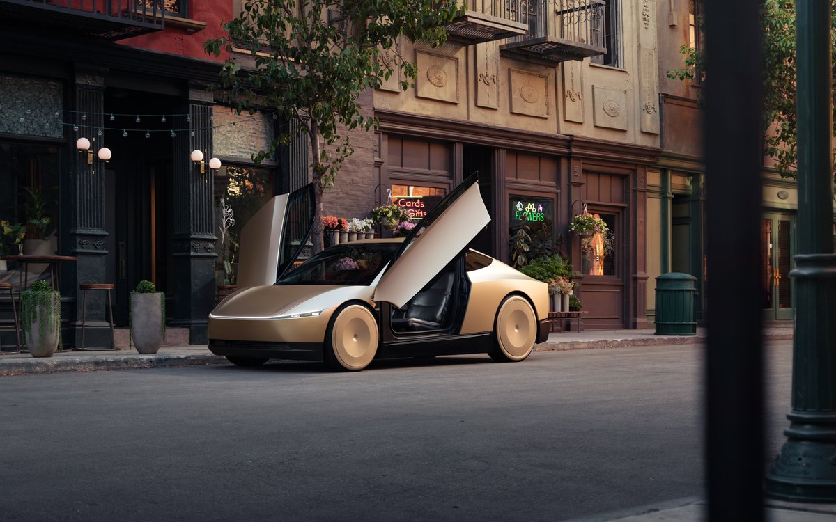 A Tesla Cybercab with its gull-wing doors open on a staged street.