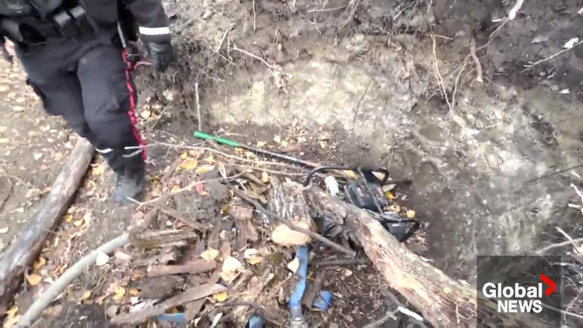 A generator buried in the ground that was used to pump water to the huts at the encampment in southeast Edmonton.