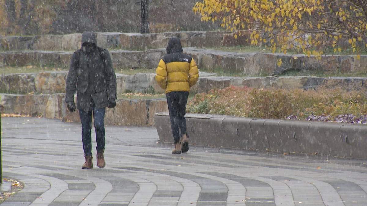 Calgarians were forced to bundle up against the cold, wind and snow as the first blast of winter weather arrived in the city this morning (Oct. 21, 2024)