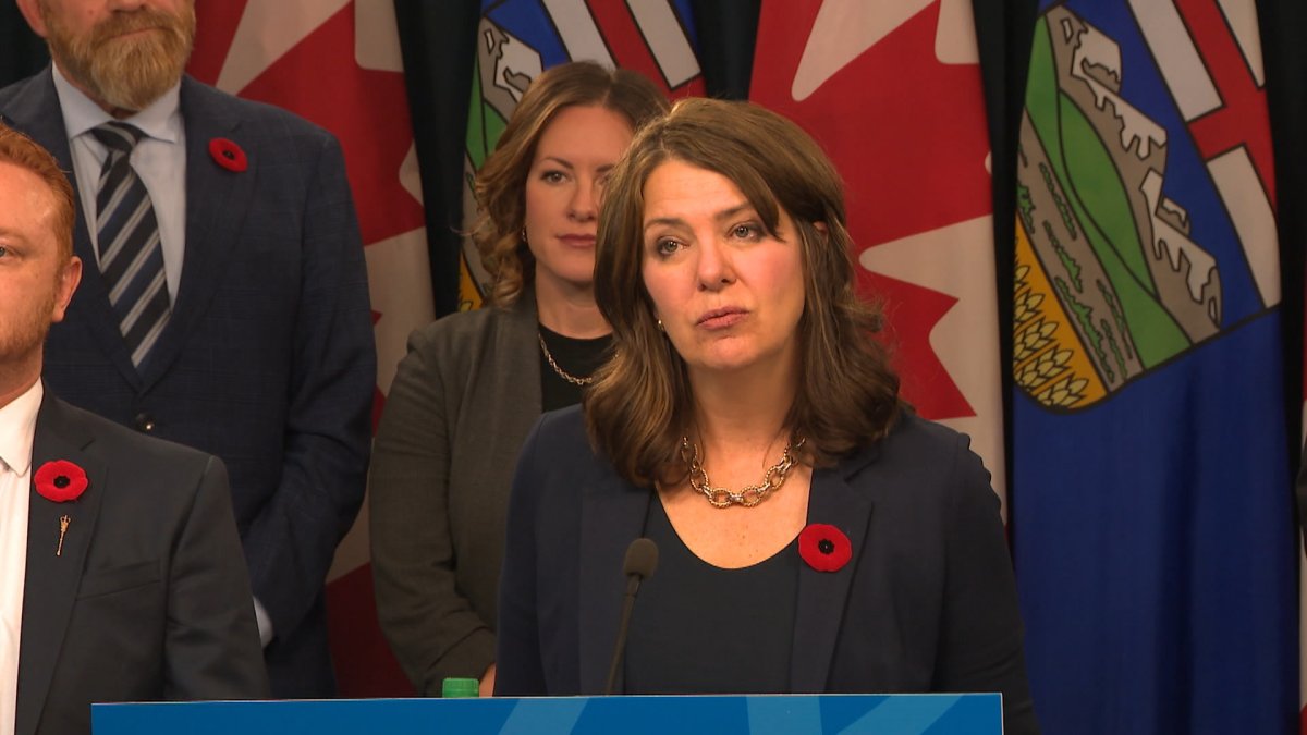 Premier Danielle Smith seen hosting a news conference at the Alberta legislature in Edmonton on Tuesday, Oct. 29, 2024, says she doesn’t think her cabinet ministers and political staff accepting tickets to luxury suites at playoff hockey games runs afoul of ethics rules.