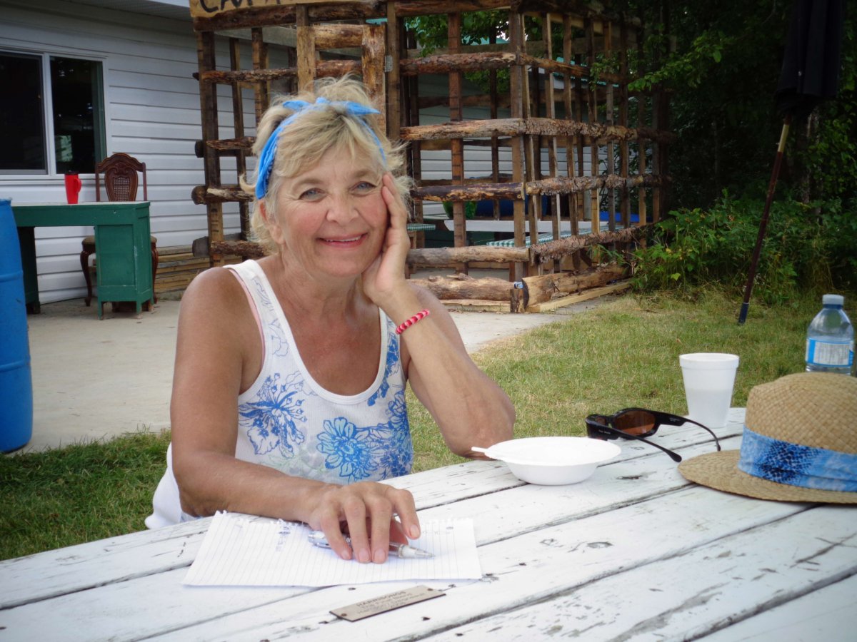 Ywanna (Jean) Backman sitting at a picnic table.