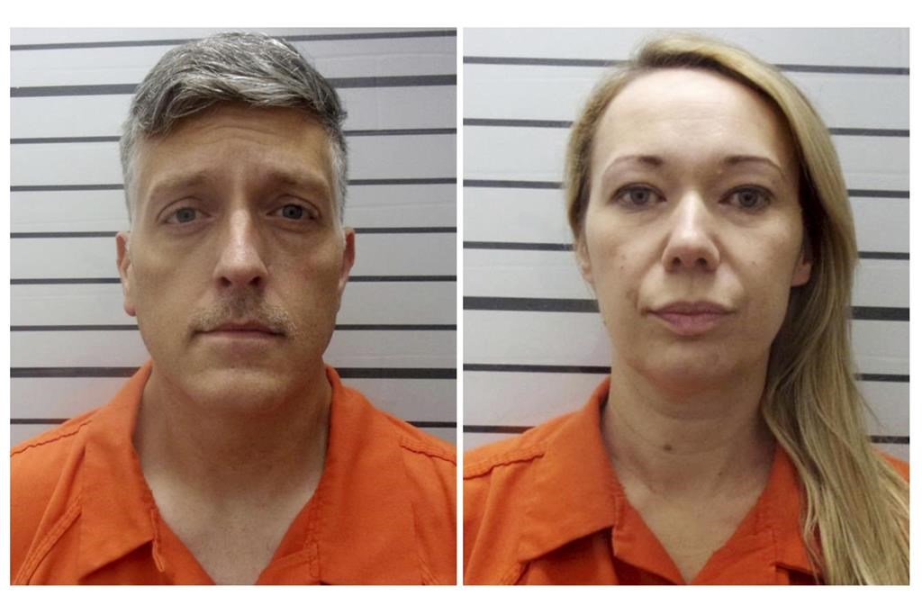 This combination of booking photos provided by the Muskogee County, Okla., Sheriff's Office shows Jon Hallford, left, and Carie Hallford, owners of Return to Nature Funeral Home.