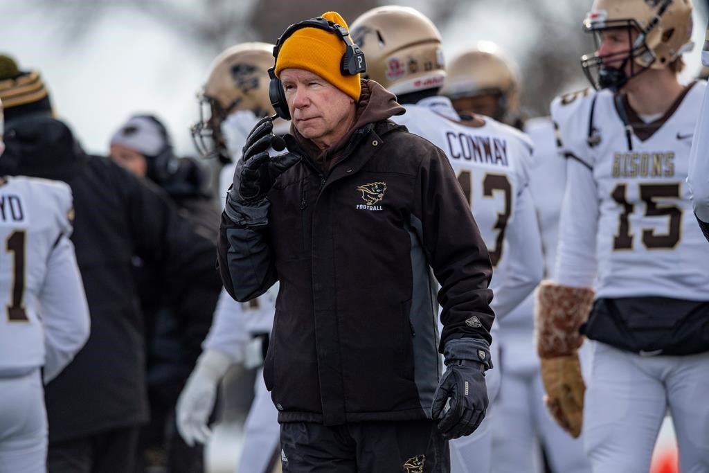 University of Manitoba head coach Brian Dobie looks on as his team takes on the University of Saskatchewan during the first quarter of the Canada West Hardy Cup in Saskatoon, Sask., Saturday, Nov. 20, 2021. 