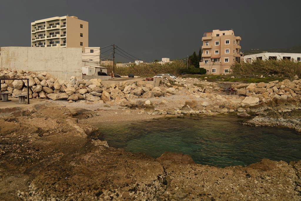 A building, left, in Batroun, northern Lebanon, Saturday, Nov. 2, 2024, where Lebanese officials say a ship captain was taken away by a group of armed men who landed on a coast north of Beirut and they're investigating whether Israel was involved. (AP Photo/Hussein Malla).