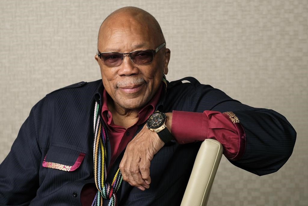 FILE - Music producer Quincy Jones poses for a portrait to promote his documentary "Quincy" during the Toronto Film Festival on Sept. 7, 2018, in Toronto.