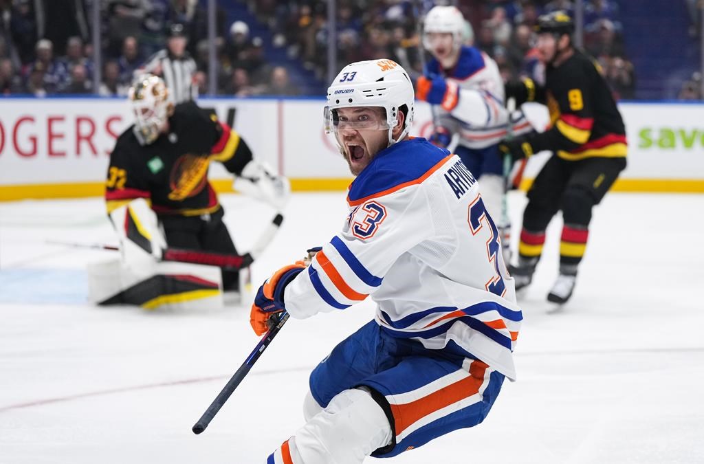 Edmonton Oilers' Viktor Arvidsson (33) celebrates his goal against the Vancouver Canucks during the second period of an NHL hockey game in Vancouver, on Saturday, Nov. 9, 2024.