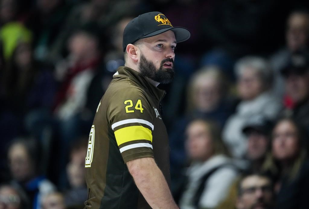 Manitoba-Carruthers third Reid Carruthers watches his shot while playing Team Manitoba-Dunstone during the playoffs at the Brier, in Regina, Friday, March 8, 2024. THE CANADIAN PRESS/Darryl Dyck.