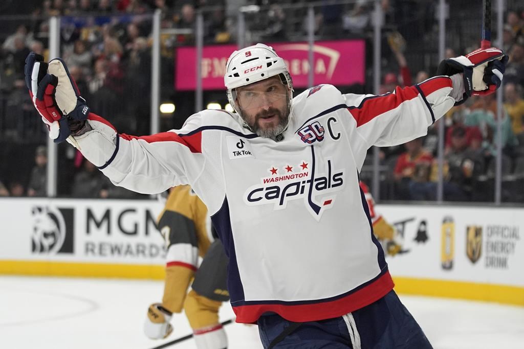 Washington Capitals left wing Alex Ovechkin (8) celebrates after scoring against the Vegas Golden Knights for a hat trick during the third period of an NHL hockey game Sunday, Nov. 17, 2024, in Las Vegas.