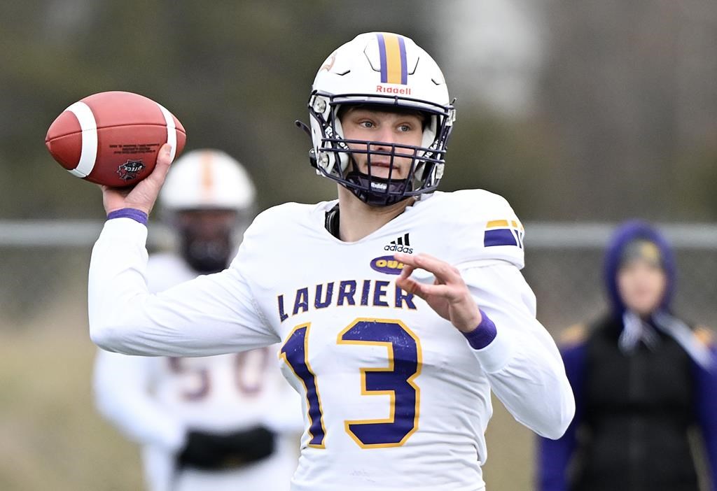 Laurier Golden Hawks quarterback Taylor Elgersma throws a pass during first-half Uteck Bowl football action against the Bishop's Gaiters in Lennoxville, Que., Saturday Nov. 16, 2024.