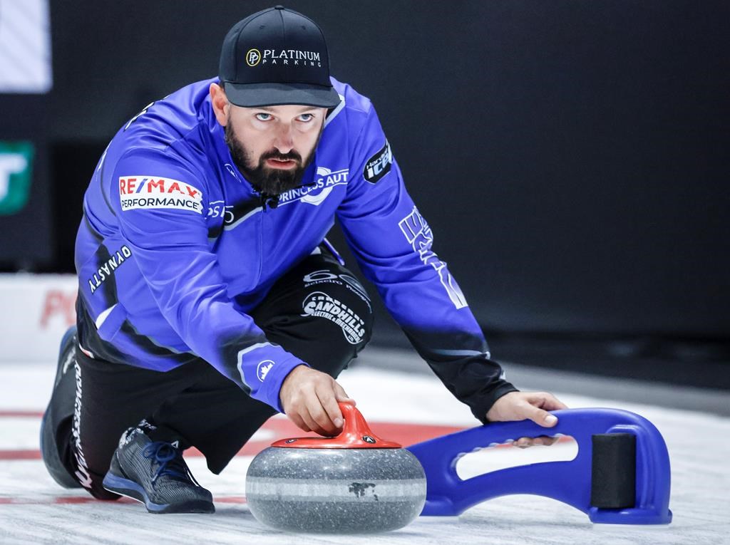 Team Carruthers skip Reid Carruthers delivers a stone during curling action against Team Asselin at the PointsBet Invitational in Calgary, Alta., Thursday, Sept. 26, 2024. THE CANADIAN PRESS/Jeff McIntosh.