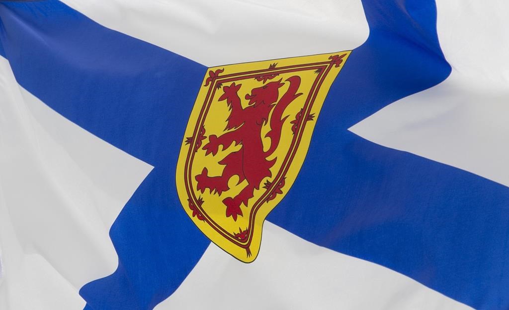 Nova Scotia's provincial flag flies on a flag pole in Ottawa on July 3, 2020. THE CANADIAN PRESS/Adrian Wyld.