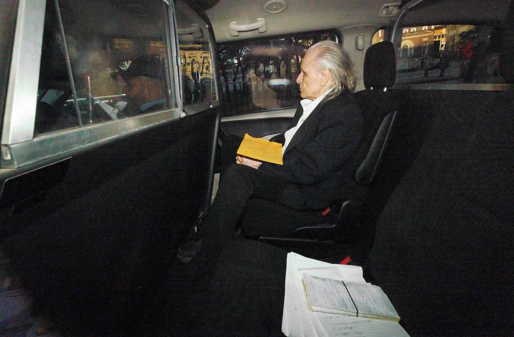 Peter Nygard in the back of a car.