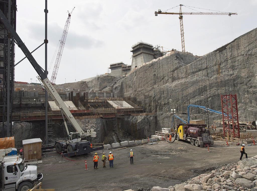 Nova Scotia's utility regulator has approved a 2.4 per cent power rate hike for 2025, though the figure would have been far higher without a federal bailout to help Nova Scotia Power cope with delays in Muskrat Falls electricity. The construction site of the hydroelectric facility at Muskrat Falls, Newfoundland and Labrador is seen on July 14, 2015. THE CANADIAN PRESS/Andrew Vaughan.