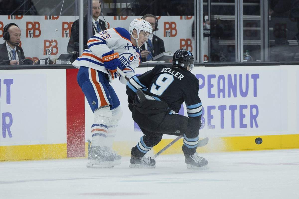 Edmonton Oilers center Ryan Nugent-Hopkins (93) passes the puck against Utah Hockey Club center Clayton Keller (9) during the second period of an NHL hockey game, Friday, Nov. 29, 2024, in Salt Lake City. (AP Photo/Melissa Majchrzak)
Melissa Majchrzak.