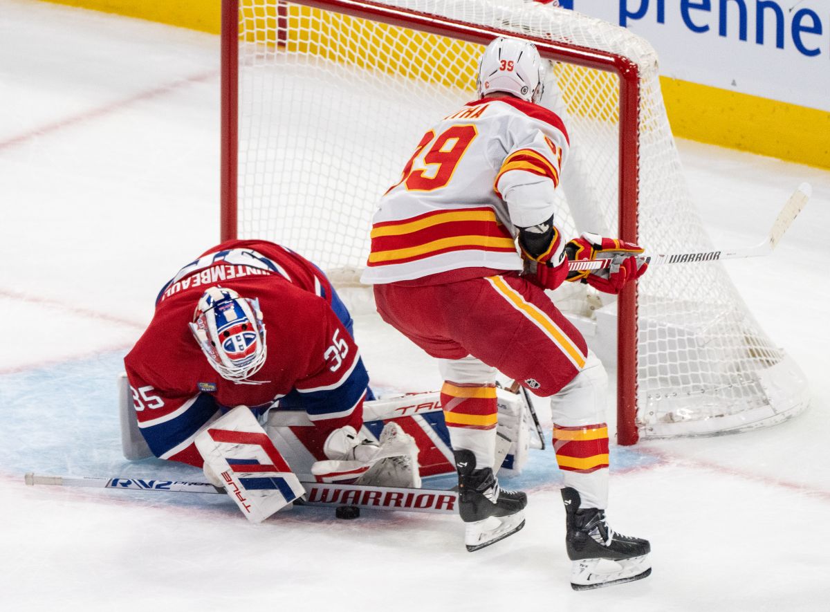 Montreal Canadiens goaltender Sam Montembeault (35) makes a save against Calgary Flames' Anthony Mantha (39) during first period NHL hockey action in Montreal on Tuesday, Nov. 5, 2024.