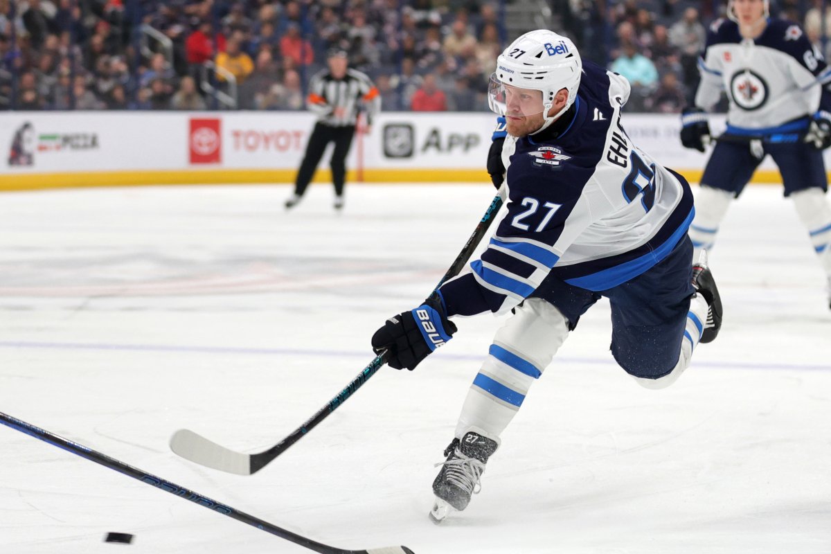 Winnipeg Jets forward Nikolaj Ehlers, right, shoots the puck against the Columbus Blue Jackets during the first period of an NHL hockey game in Columbus, Ohio, Friday, Nov. 1, 2024. Ehlers scored on the play. (AP Photo/Paul Vernon).