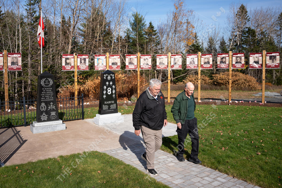 Cousins Victor Harvie, left, and Richard Harvie walk away from a new memorial honouring the war service of their fathers and uncles in the small community of Noel, N.S. on Monday, November 4, 2024. Eight brothers in total, the Harvie siblings all fought in the Second World War—six returned home, while two were killed and are buried overseas. THE CANADIAN PRESS/Darren Calabrese.