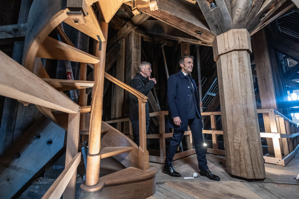 French President Emmanuel Macron (R), accompanied by President of the "Rebatir Notre-Dame de Paris" public establishment Philippe Jost (L) visits the Notre-Dame de Paris Cathedral in Paris, on November 29, 2024.