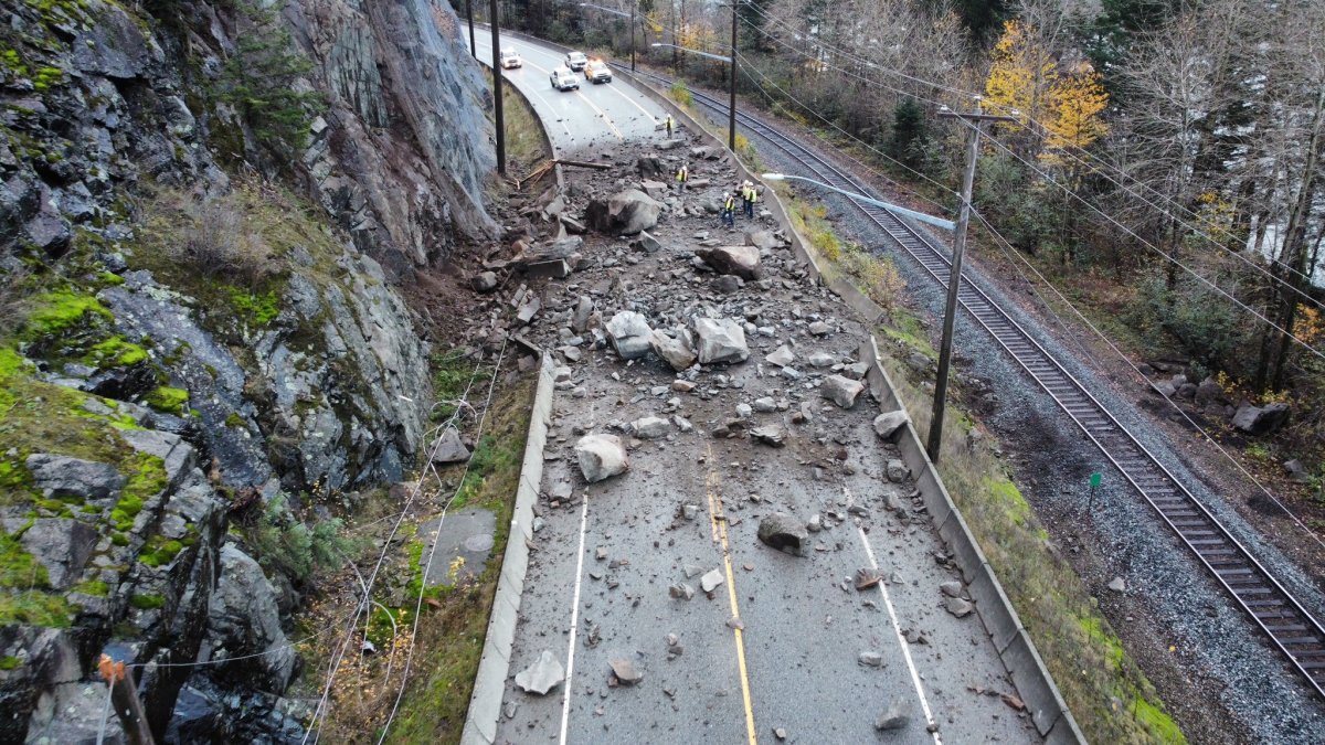 Crews assess the damage to Highway 7 caused by a rockslide west of Hope, B.C., on Friday, Nov. 15, 2024.