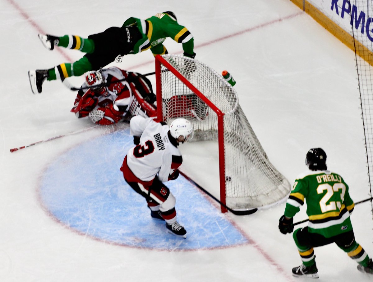 Sam Dickinson flies through the air after scoring in a 10-3 London Knights win ov er the Ottawa 67's on Dec. 1, 2024.