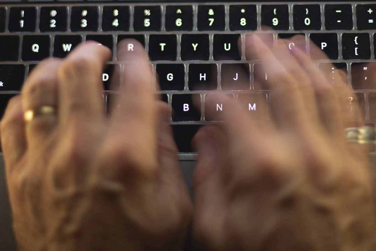 A file photo of someone typing on a keyboard.