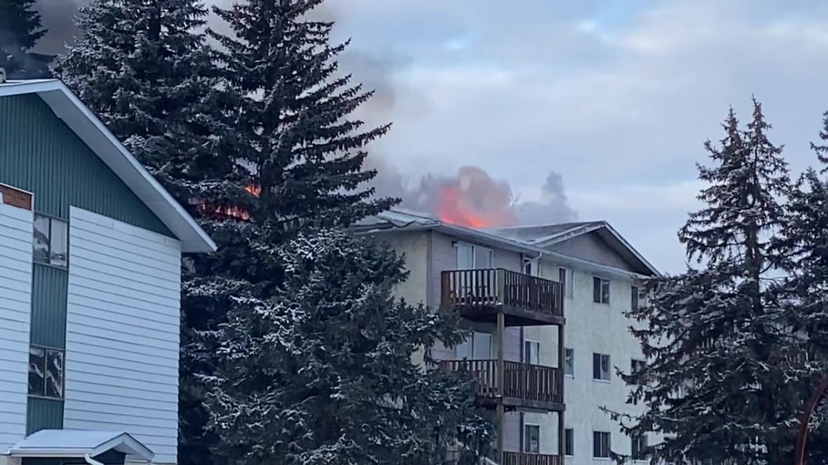 An apartment building on fire in Peace River, Alta. on Thursday, November 28, 2024.