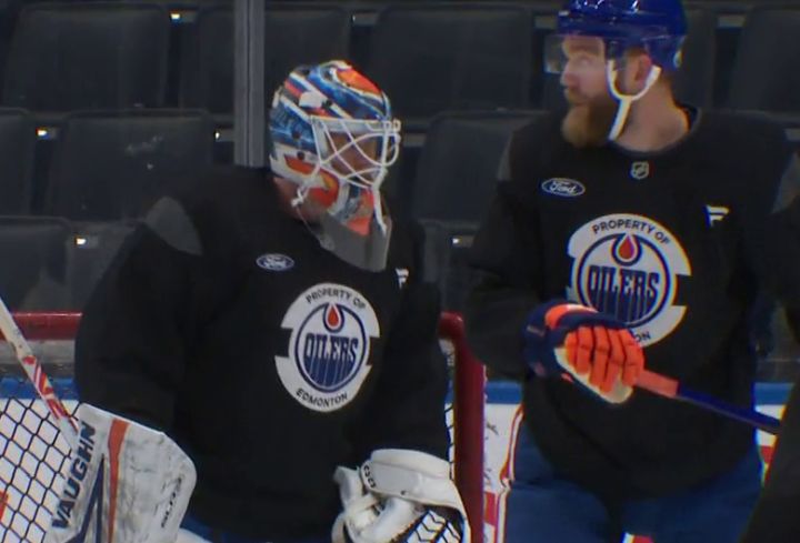 Stuart Skinner (left) and Mattias Ekholm (right) are seen at an Edmonton Oilers practice at Rogers Place in November 2024.