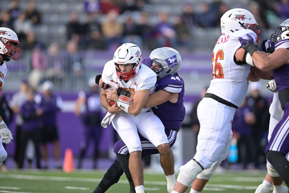 Western Mustang linebacker Connor Franzisi wraps up Guelph Gryphons quarterback Tristan Aboud in Yates Cup semi-final action on Nov. 2, 2024 at Western Alumni Stadium.