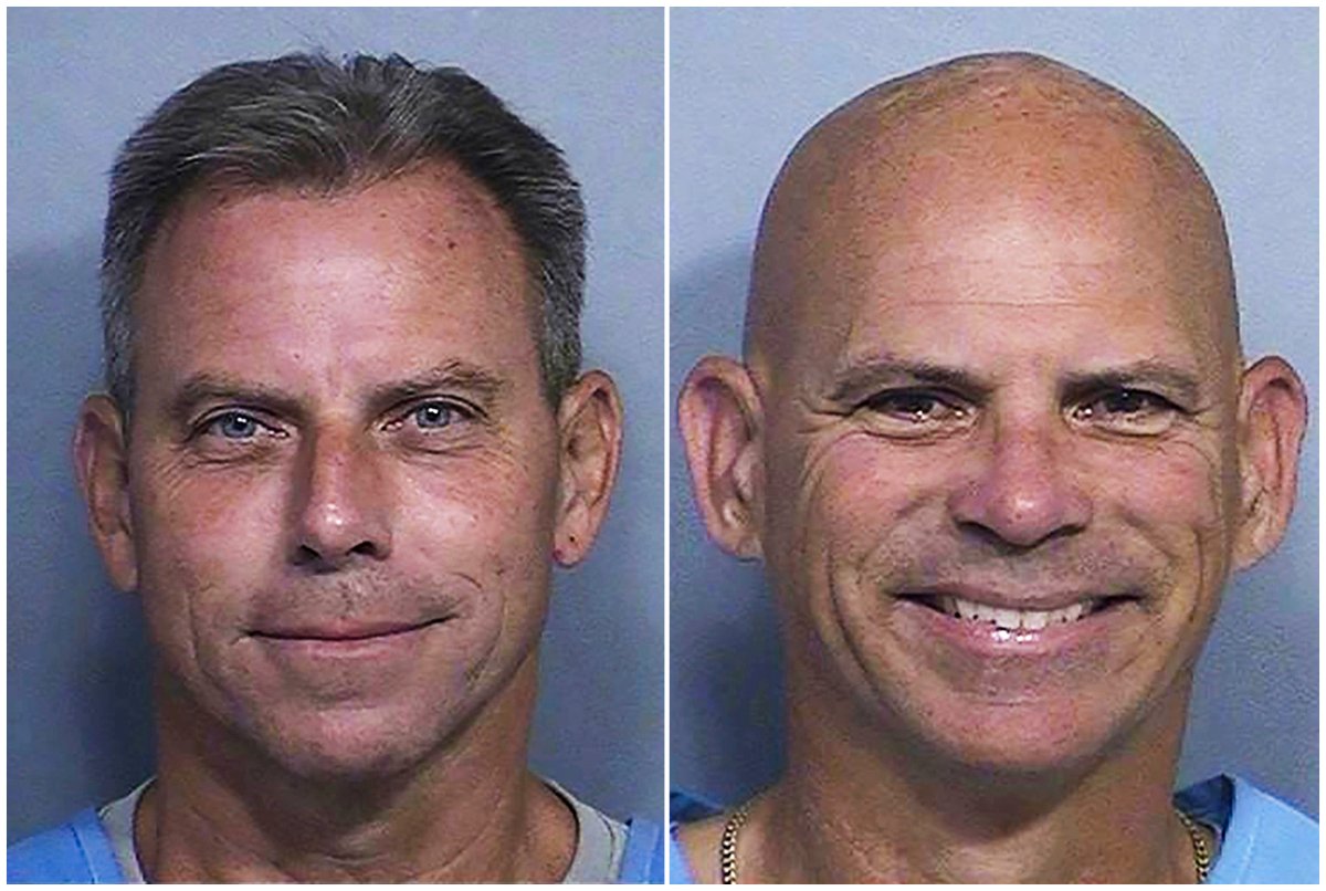 This combination of two booking photos provided by the California Department of Corrections shows Erik Menendez, left, and Lyle Menendez.