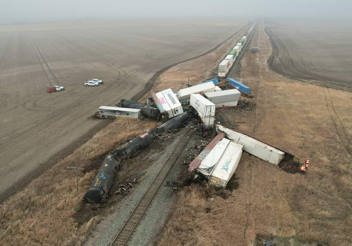 The RCMP says one of the rail cars involved in a derailment near Beiseker is leaking dangerous goods, but there is no danger to t he public.