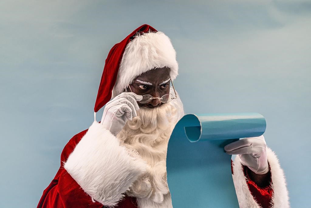 Alex Appiah poses as Santa Claus in an undated promotional photograph for West Edmonton Mall. The 29-year-old is making this December the one to remember as he becomes one of the first Black actors to play the Jolly Old Elf at the shopping complex.