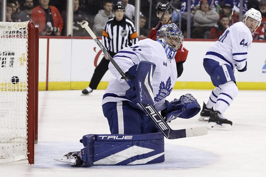 Toronto Maple Leafs goaltender Anthony Stolarz looks back at a goal scored by New Jersey Devils left wing Ondrej Palat during the second period of an NHL hockey game Tuesday, Dec. 10, 2024, in Newark, N.J. 