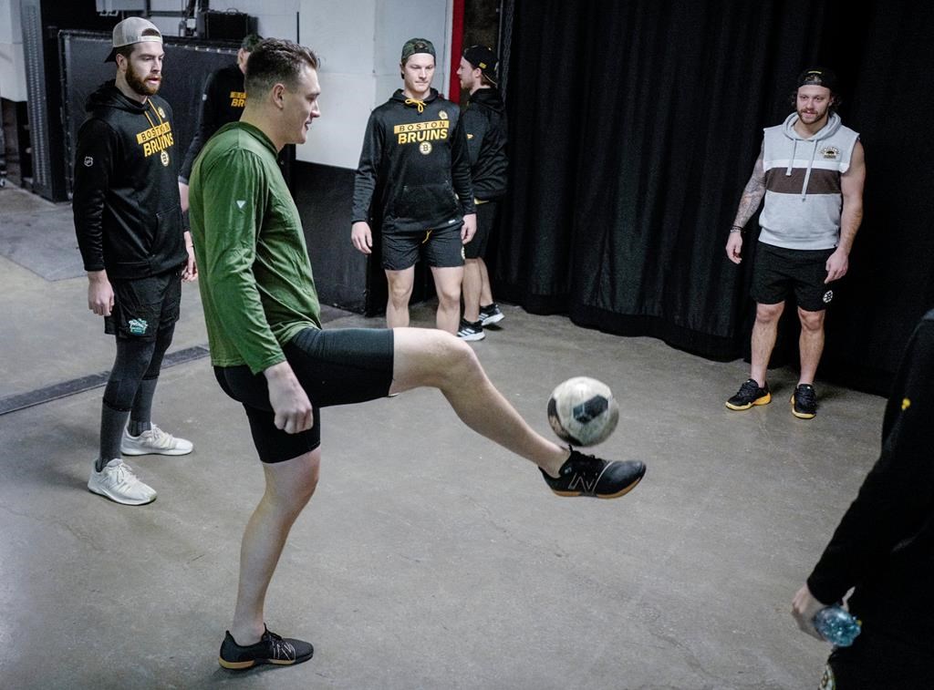 Boston Bruins players play "sewer ball" in the bowels of the Saddledome prior to playing the Calgary Flames in an NHL hockey game in Calgary on Tuesday, Dec. 17, 2024.